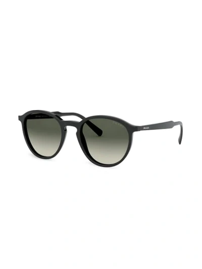 Shop Prada Round Frame Sunglasses In Black