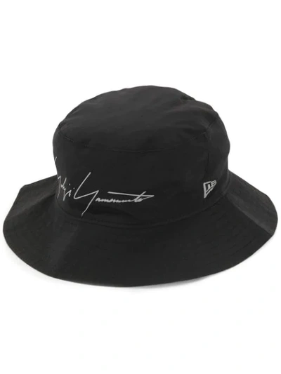 Shop Yohji Yamamoto Logo Print Bucket Hat In Black
