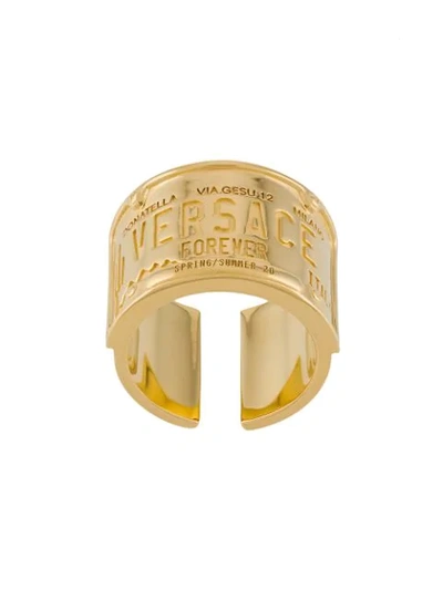 Shop Versace Engraved Logo Ring In Gold