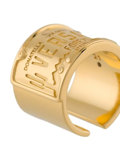 Shop Versace Engraved Logo Ring In Gold