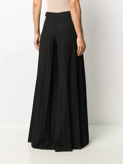 Shop Nina Ricci Pleated Palazzo Trousers In Black