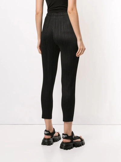 Shop Issey Miyake Cropped Pleated Trousers In Black