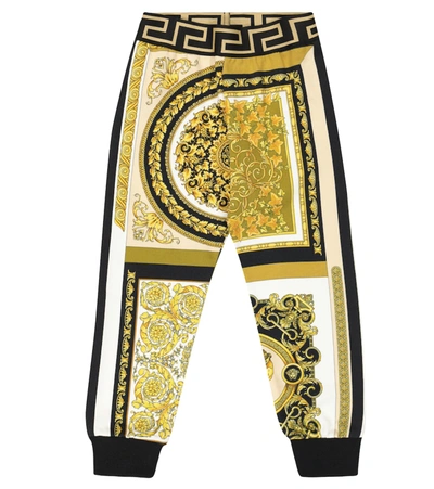 Shop Versace Printed Cotton-jersey Trackpants In Gold