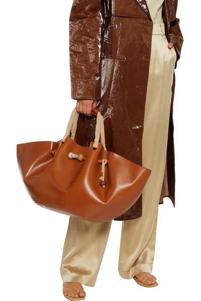 Shop Nanushka Lynne Bead-embellished Gathered Leather Tote In Tan
