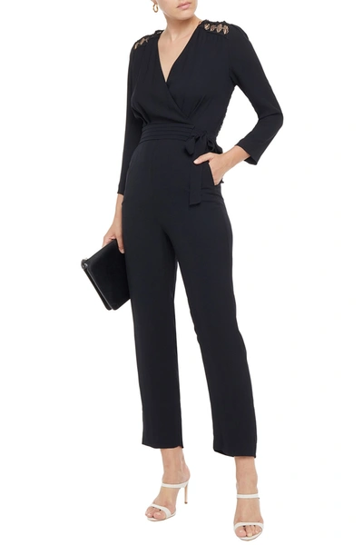 Shop Sandro Noya Wrap-effect Macramé Lace-paneled Crepe Jumpsuit In Black