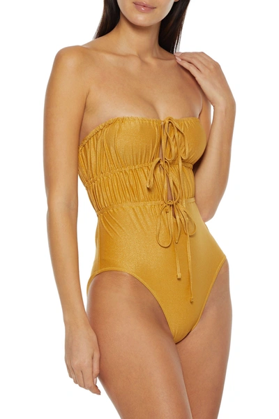 Shop Solid & Striped The Paula Ruched Metallic Bandeau Swimsuit In Gold