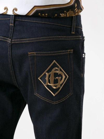 Shop Dolce & Gabbana Logo Patch Bootcut Jeans In Blue