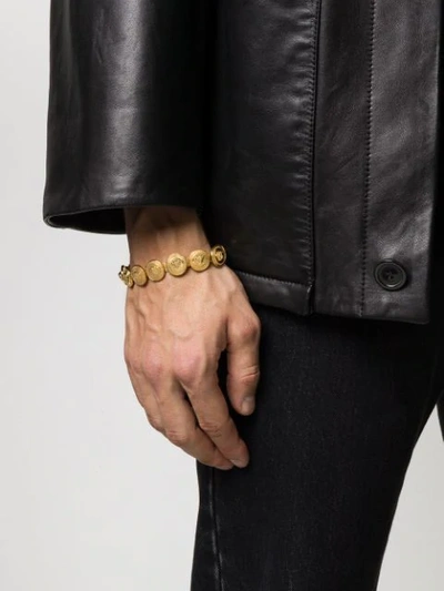 Shop Versace Medusa Charm Bracelet In Gold