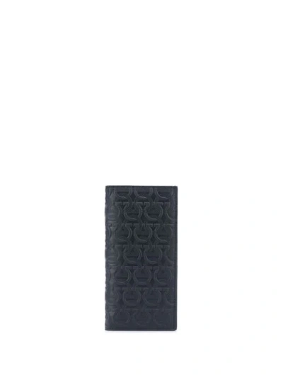 Shop Ferragamo Gancini Embossed Wallet In Black