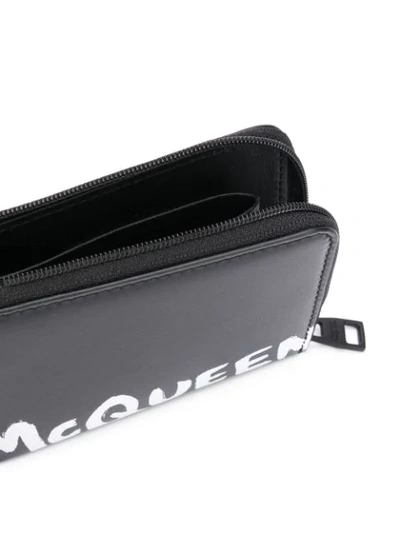 Shop Alexander Mcqueen Logo Print Zipped Wallet In Black