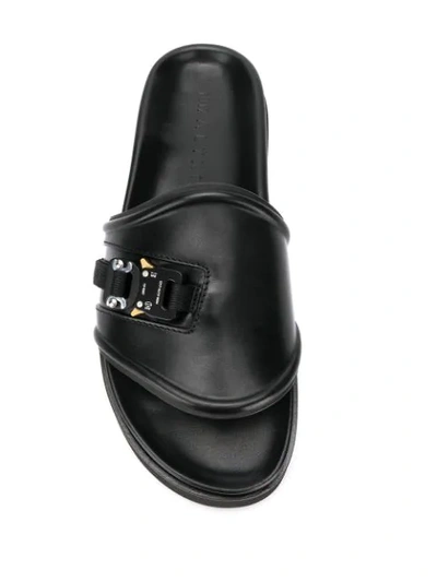 Shop Alyx Rollercoaster Buckle Slides In Black