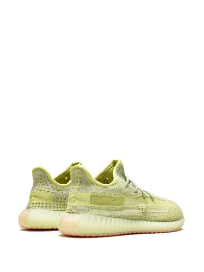 Shop Adidas Originals Yeezy Boost 350 V2 Sneakers In Yellow