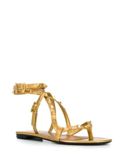 Shop Valentino Rockstud Flair Sandals In Gold