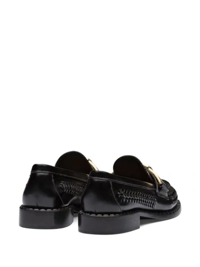 Shop Prada Buckled Woven Loafers In Black
