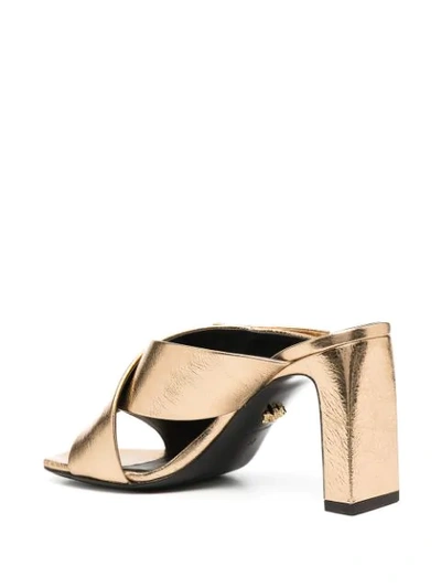 Shop Versace V-logo Chunky-heel Mules In Gold
