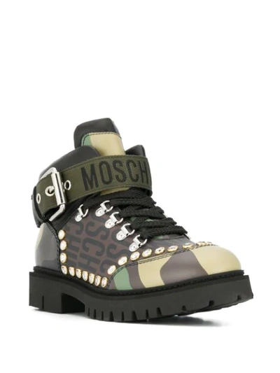 Shop Moschino Studded Camouflage Boots In Brown