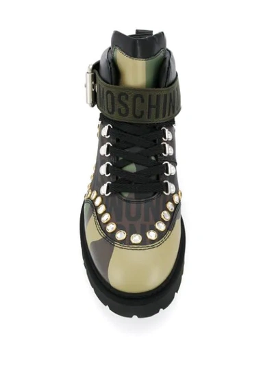 Shop Moschino Studded Camouflage Boots In Brown