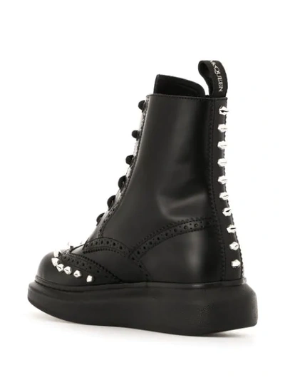 Shop Alexander Mcqueen Studded Ankle Boots In Black