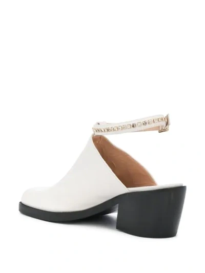 Shop Nodaleto Ankle Strap Mules In White