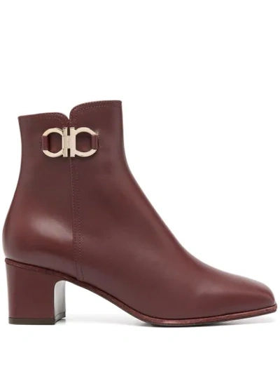 Shop Ferragamo Gancini Plaque Ankle Boots In Red