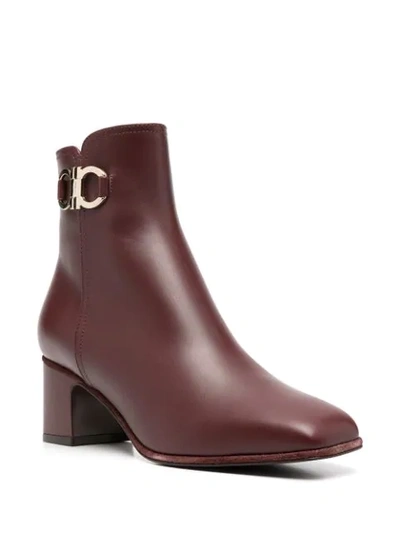 Shop Ferragamo Gancini Plaque Ankle Boots In Red