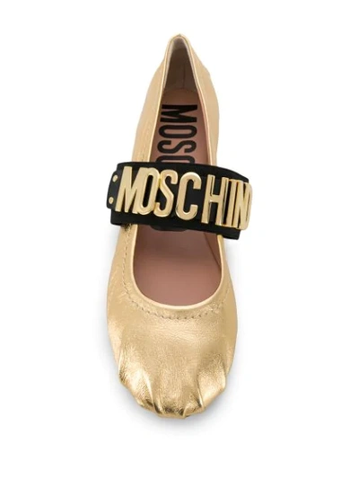 Shop Moschino Gold Logo Strap Ballerina Pumps