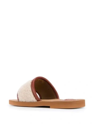 Shop Chloé Woody Shearling Slides In Neutrals