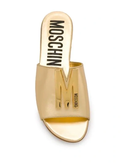 Shop Moschino M Plaque Sandals In 901 Gold