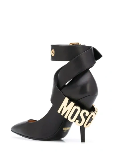 Shop Moschino Buckled Ankle Strap Pumps In Black