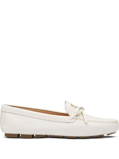 Shop Prada Bow Detail Loafers In White