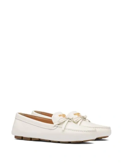 Shop Prada Bow Detail Loafers In White