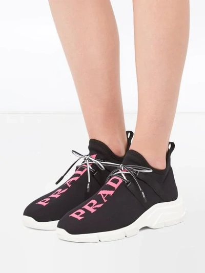 Shop Prada Logo Knitted Sneakers In Black