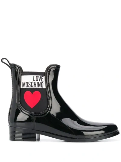 Shop Love Moschino Heart Print Rain Boots In Black