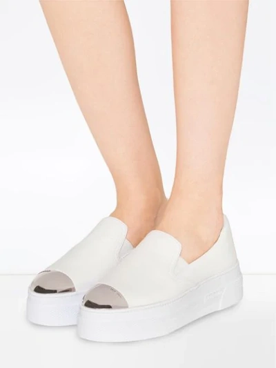 Shop Miu Miu Metal Cap Slip-on Sneakers In White