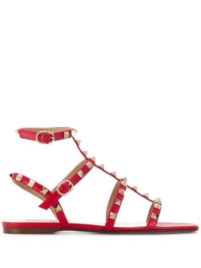 Shop Valentino Rockstud Flat Sandals In Red