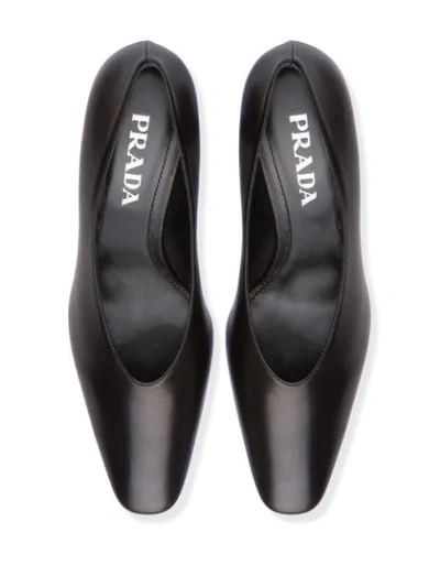 Shop Prada Almond Toe Mid-heel Pump In Black
