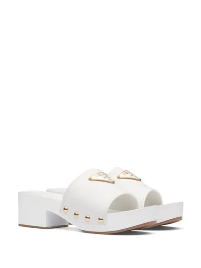 Shop Prada Logo Plaque Clog Sandals In White