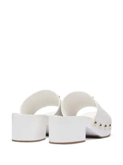 Shop Prada Logo Plaque Clog Sandals In White
