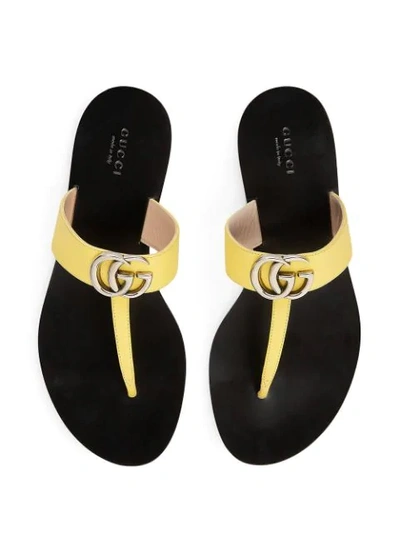 Shop Gucci Gg Motif Thong Sandals In Yellow