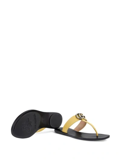 Shop Gucci Gg Motif Thong Sandals In Yellow