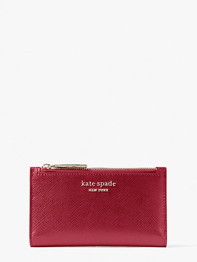 Shop Kate Spade Spencer Small Slim Bifold Wallet In Red Currant