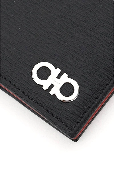 Shop Ferragamo Bi-fold Gancini Wallet In Black,red