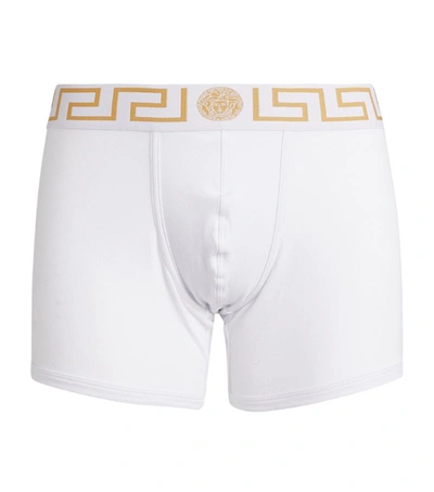 Shop Versace Iconic Greca Long Trunks In White
