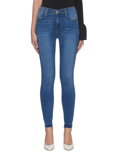 Shop Frame Le High' Raw Edge Denim Skinny Jeans In Blue