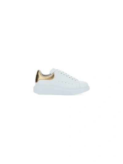 Shop Alexander Mcqueen Sneakers In White/gold