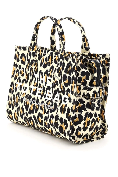 Marc Jacobs - Amber with THE LEOPARD TRAVELER TOTES. Shop