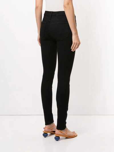 Shop Mother The Looker Mid-rise Skinny Jeans In Black