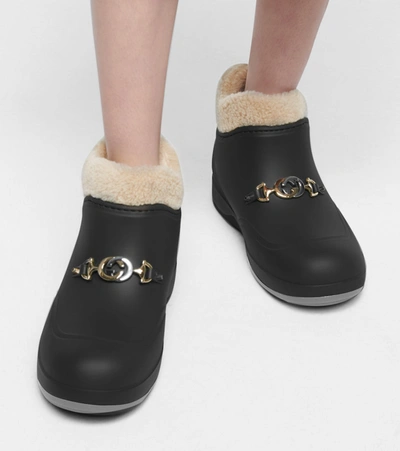 Shop Gucci Faux Shearling Rubber Ankle Boots In Black