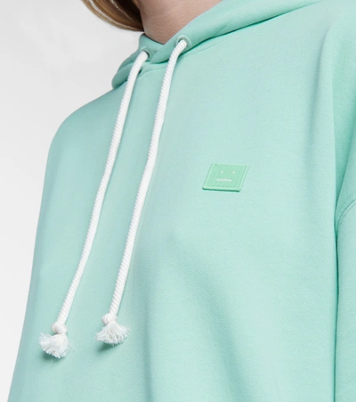 Shop Acne Studios Oversized Cotton Jersey Hoodie In Green