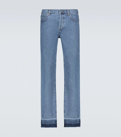 Shop Jw Anderson Slim-fit Raw Hemmed Jeans In Blue